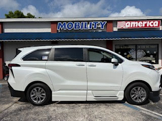 A wheelchair-accessible Toyota Sienna parked outside the Mobility America showroom