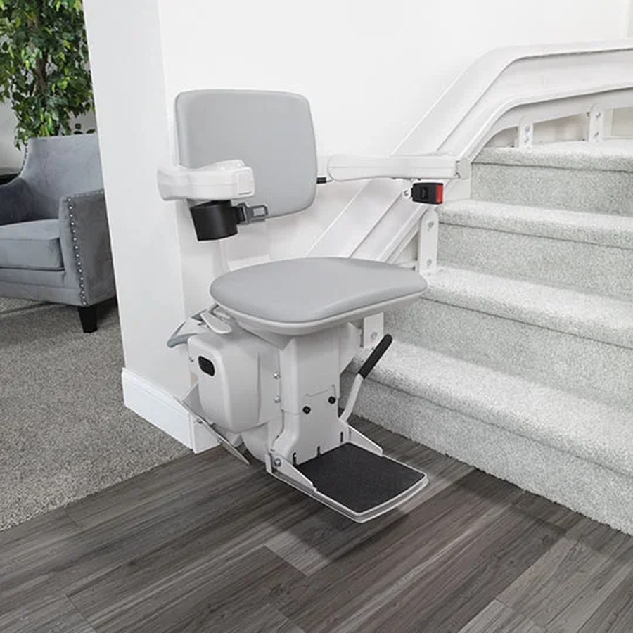 Bruno Elite curved stair lift following a curved indoor staircase