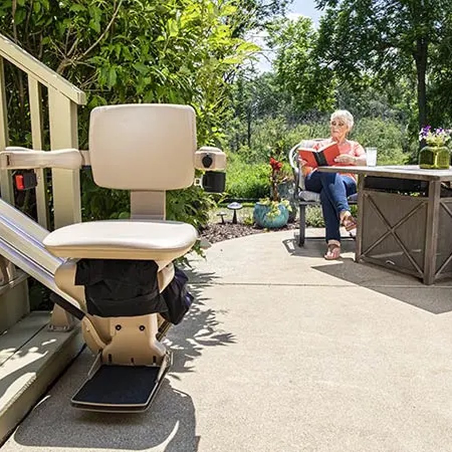 Bruno Elite straight outdoor stair lift beside a patio