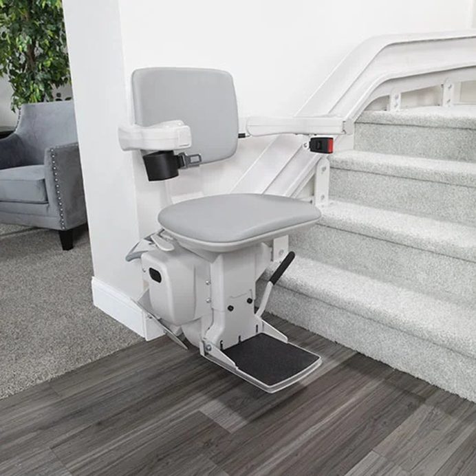 Bruno Elite straight stair lift on a carpeted indoor staircase