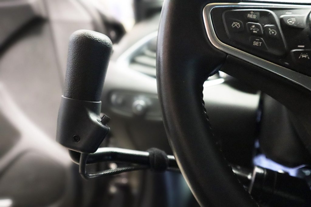 Hand controls fitted to the steering column of a pickup truck