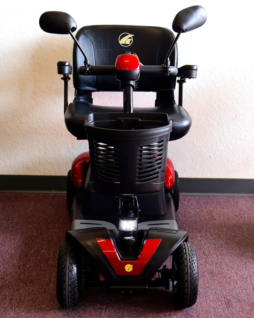 A pre-owned red mobility scooter