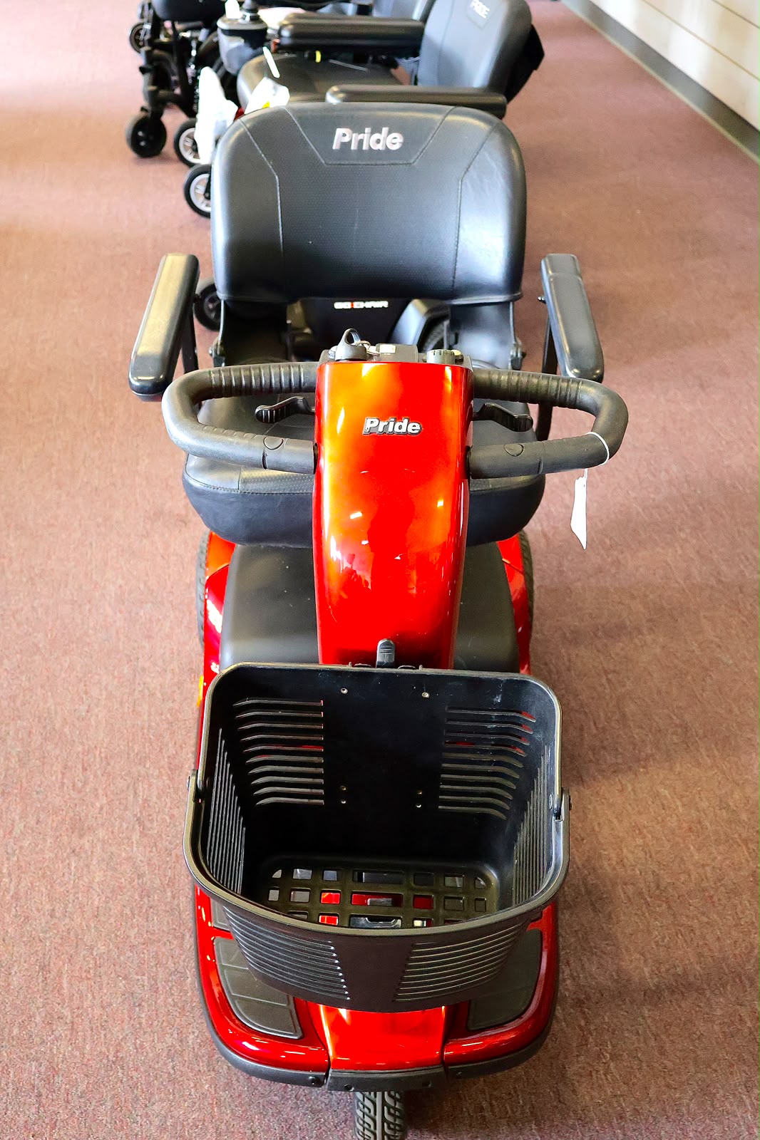 Pre-owned blue Golden LiteRider 3-wheel mobility scooter, photographed at the Mobility America showroom in Lakeland