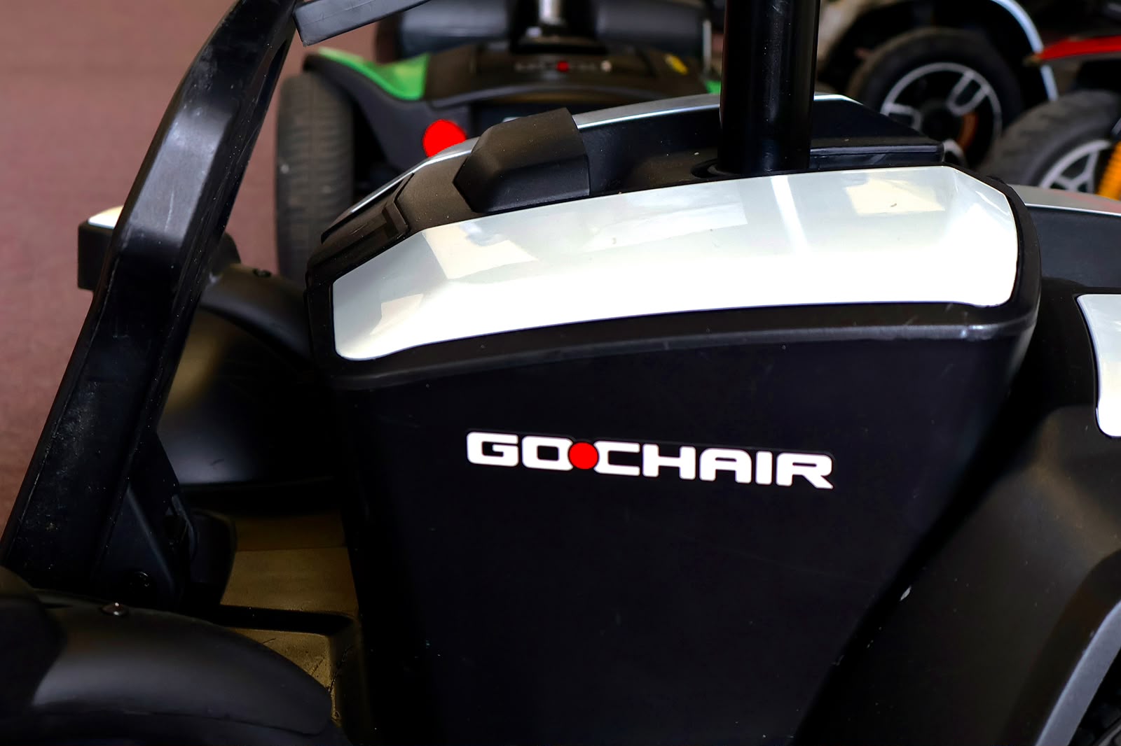 Pre-owned white Pride Go Chair power wheelchair, photographed at the Mobility America showroom in Lakeland