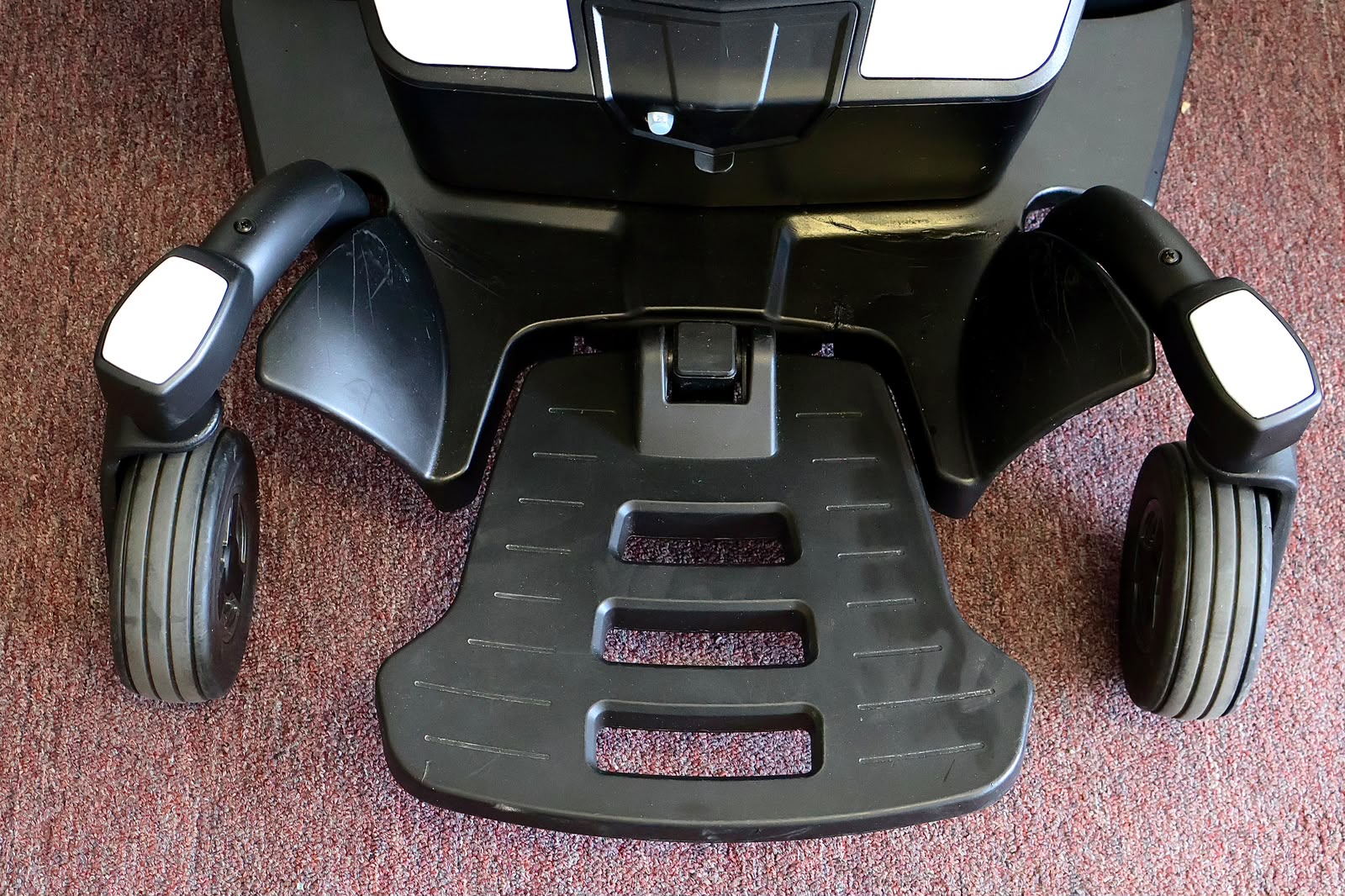 Pre-owned white Pride Go Chair power wheelchair, photographed at the Mobility America showroom in Lakeland