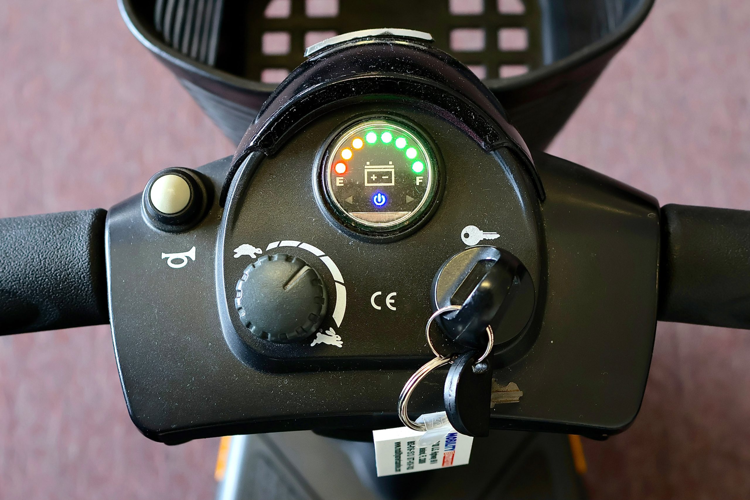 Pre-owned black Pride Go-Go Elite Traveller 3-wheel mobility scooter, photographed at the Mobility America showroom in Lakeland