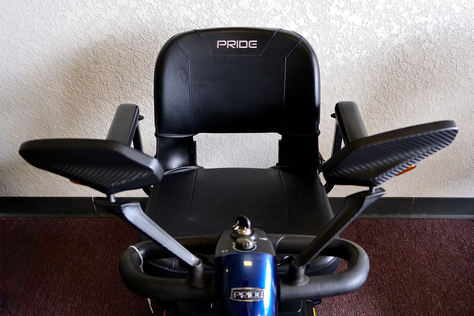 Pre-owned blue Pride Go-Go Sport 3-wheel mobility scooter, photographed at the Mobility America showroom in Lakeland