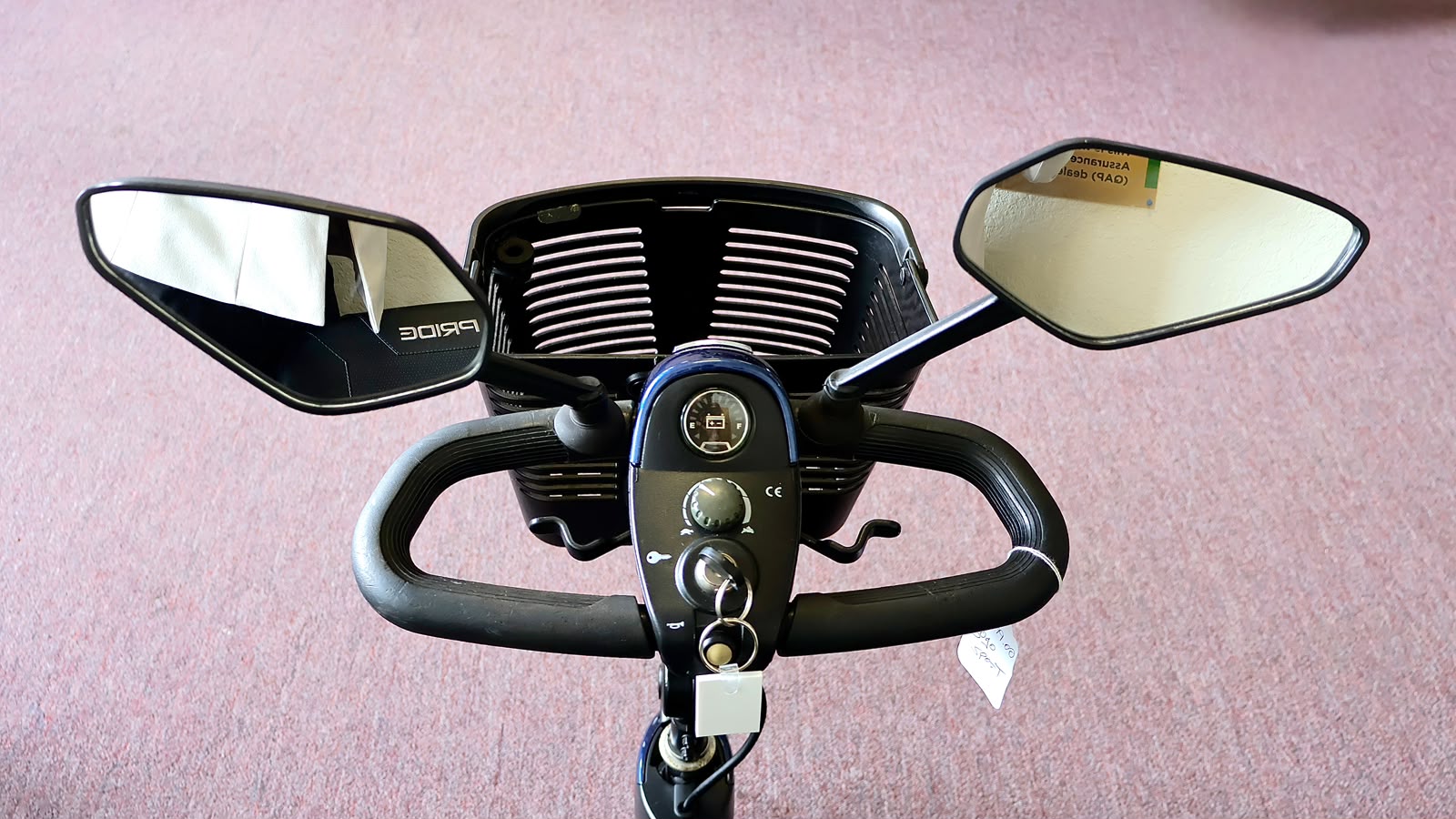 Pre-owned blue Pride Go-Go Sport 3-wheel mobility scooter, photographed at the Mobility America showroom in Lakeland