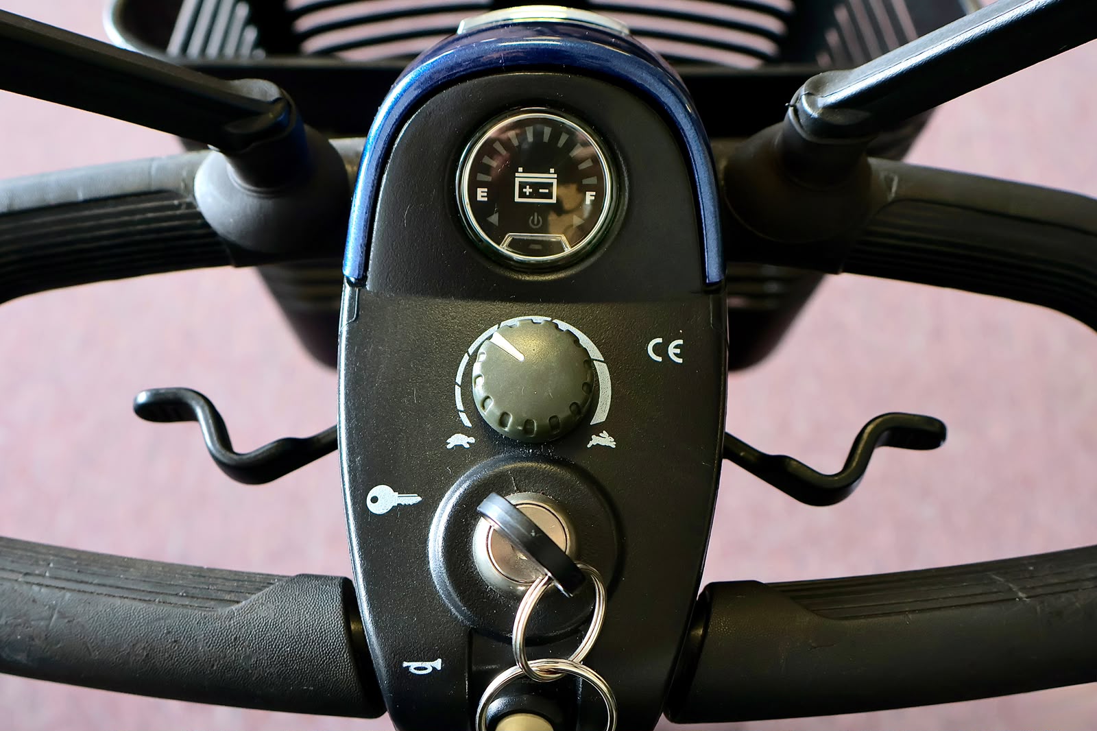 Pre-owned blue Pride Go-Go Sport 3-wheel mobility scooter, photographed at the Mobility America showroom in Lakeland