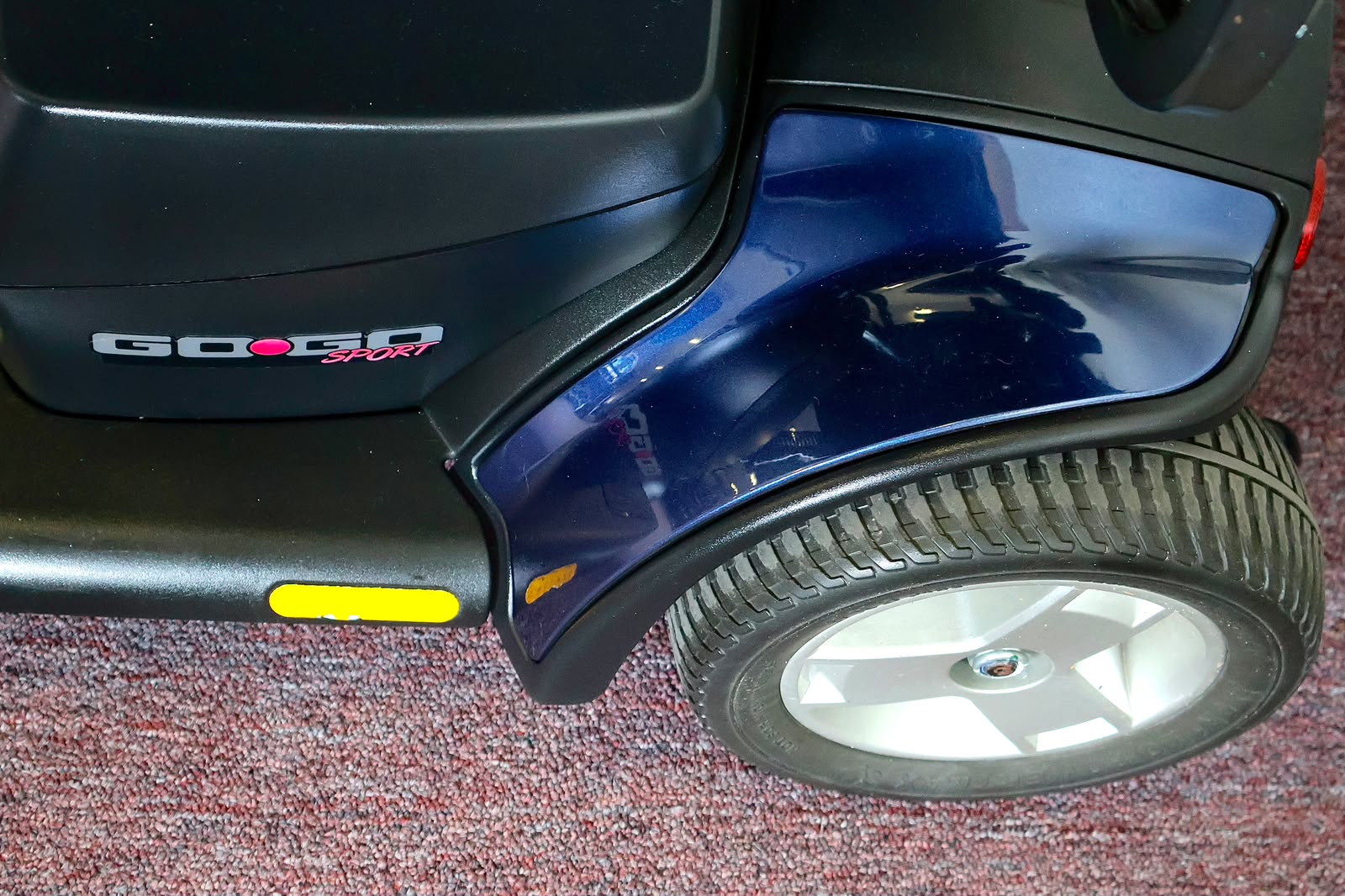 Pre-owned blue Pride Go-Go Sport 3-wheel mobility scooter, photographed at the Mobility America showroom in Lakeland