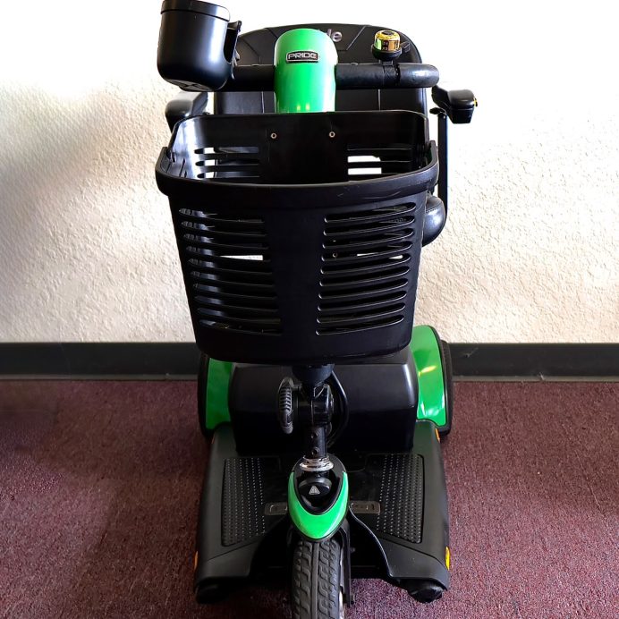Pre-owned green Pride Go-Go Sport 3-wheel mobility scooter, photographed at the Mobility America showroom in Lakeland
