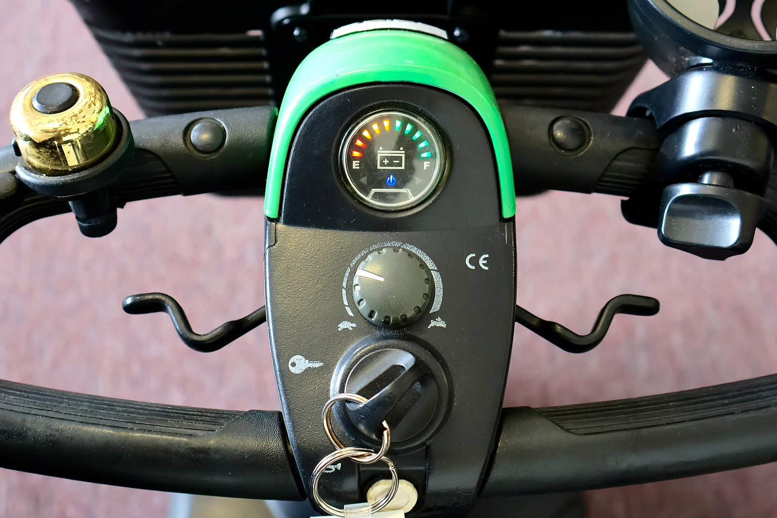 Pre-owned green Pride Go-Go Sport 3-wheel mobility scooter, photographed at the Mobility America showroom in Lakeland