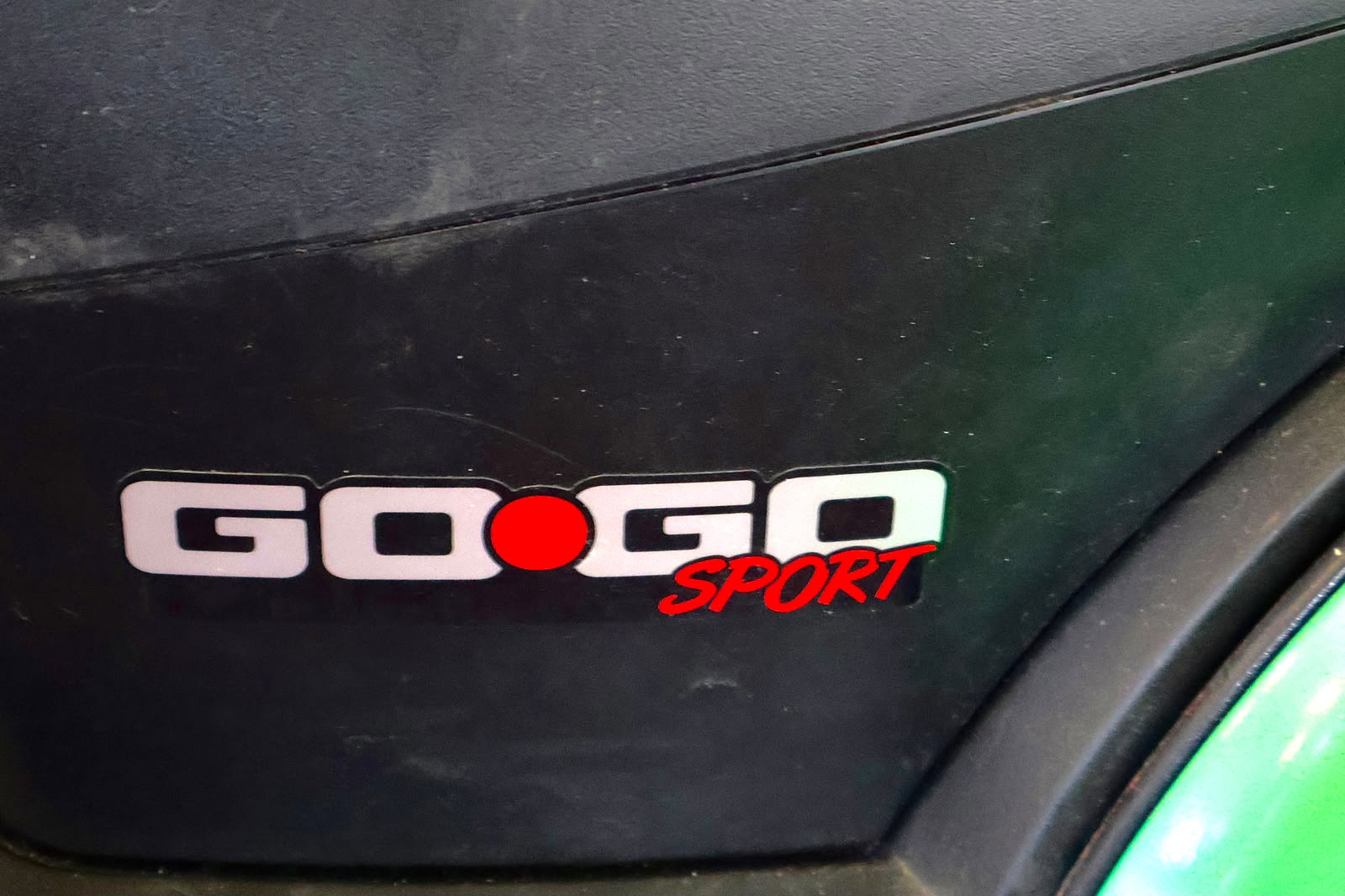 Pre-owned green Pride Go-Go Sport 3-wheel mobility scooter, photographed at the Mobility America showroom in Lakeland