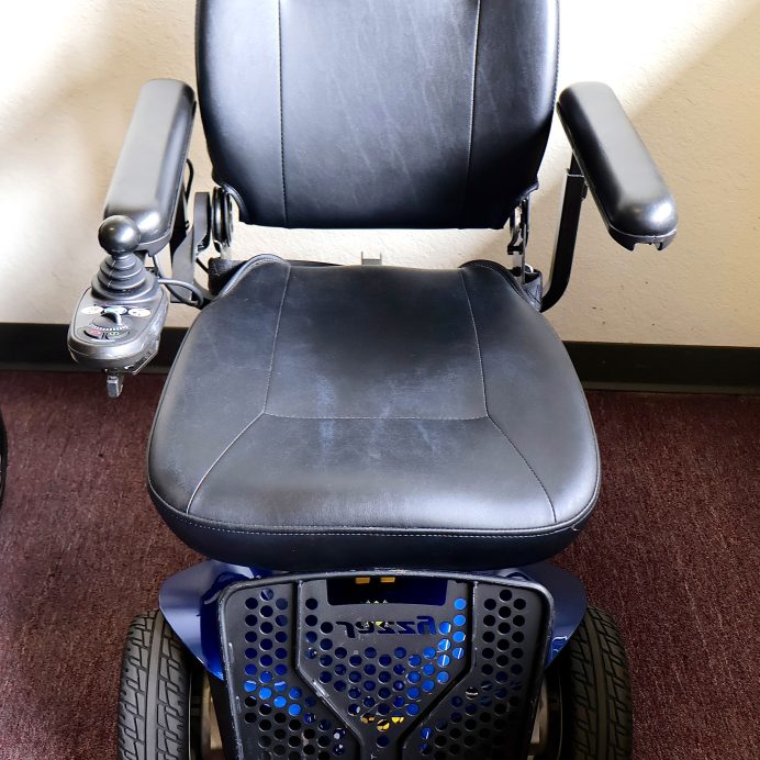 Pre-owned blue Pride Jazzy power wheelchair, photographed at the Mobility America showroom in Lakeland