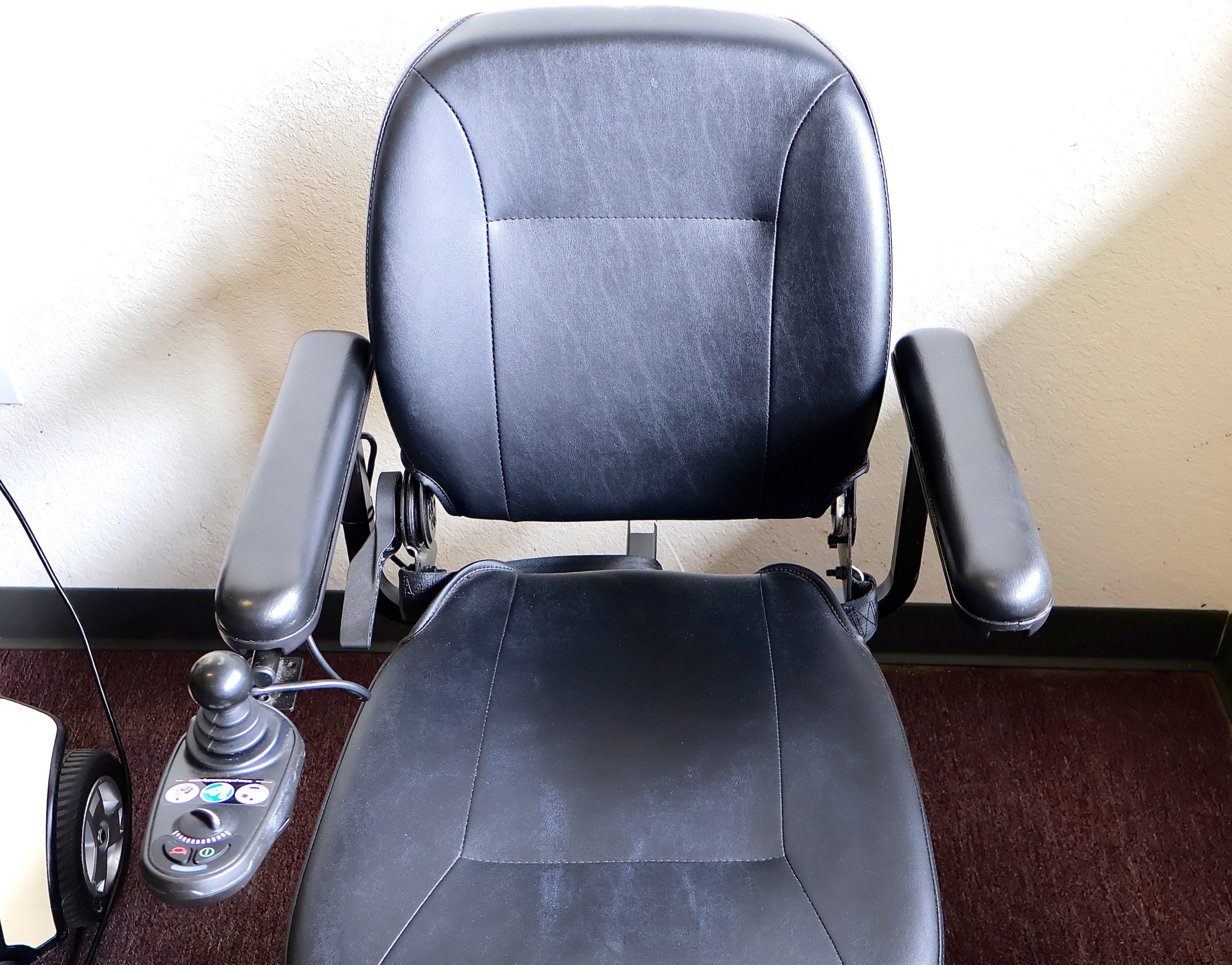 Pre-owned blue Pride Jazzy power wheelchair, photographed at the Mobility America showroom in Lakeland