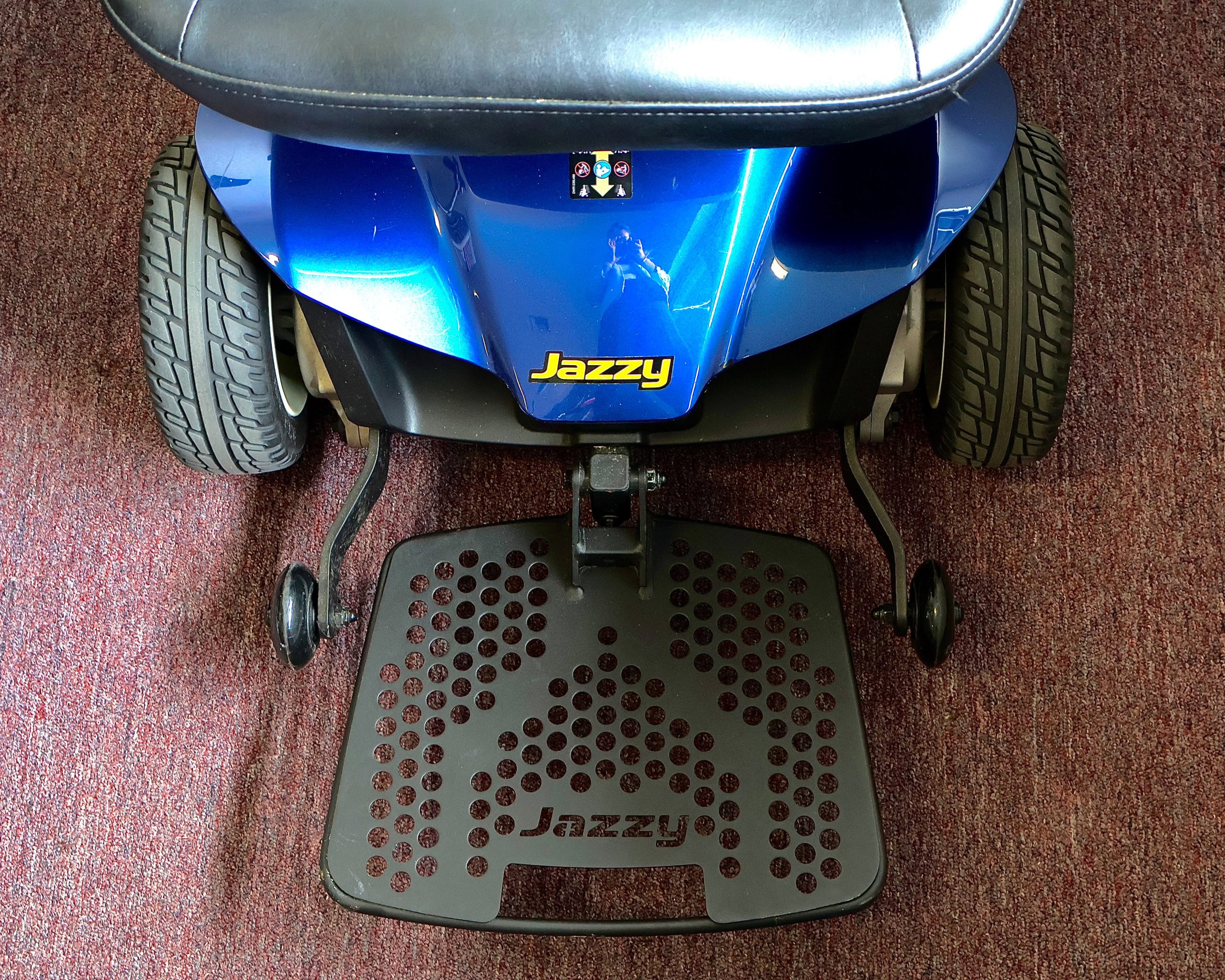 Pre-owned blue Pride Jazzy power wheelchair, photographed at the Mobility America showroom in Lakeland