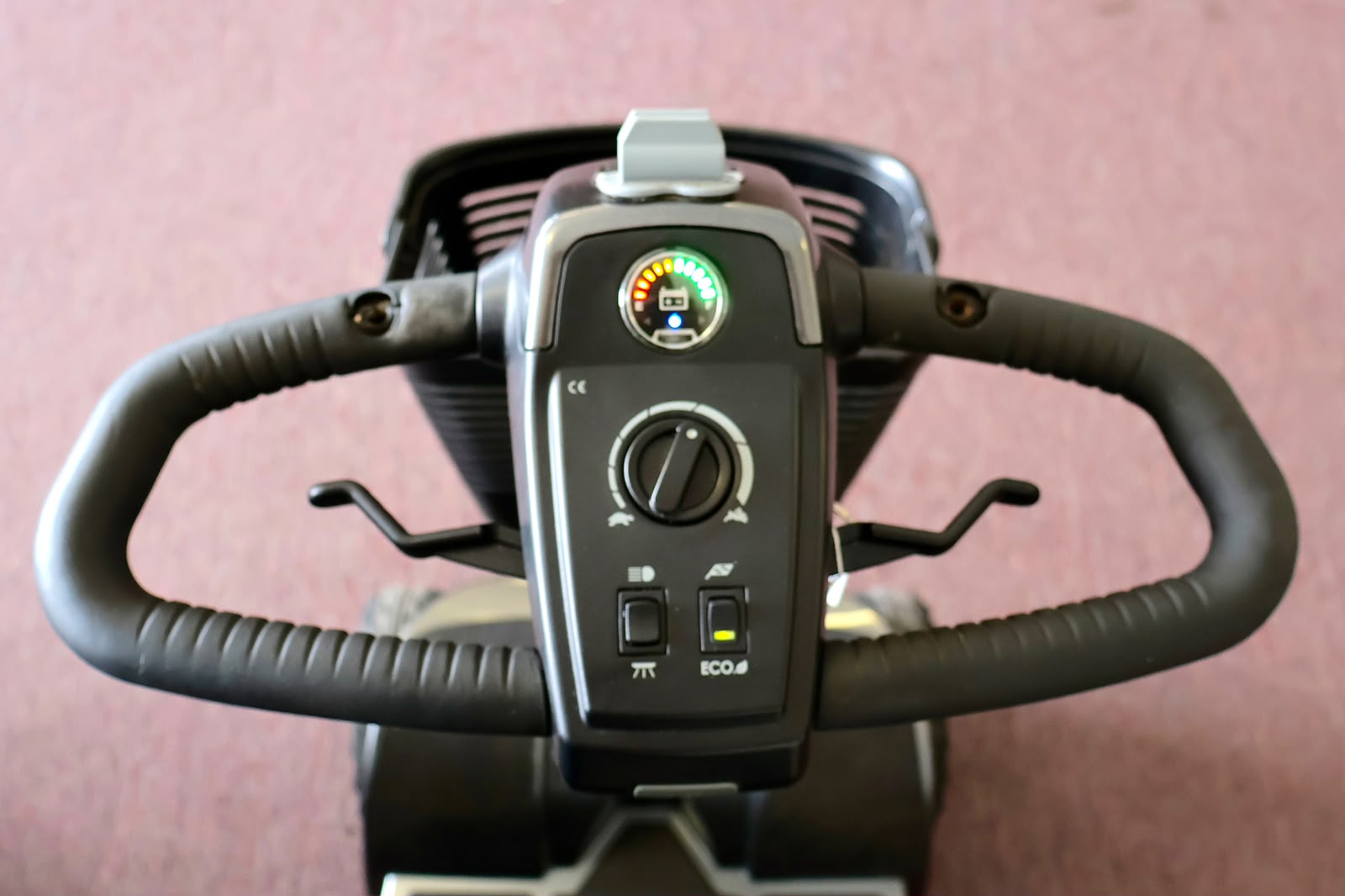 Pre-owned grey Pride Revo 2.0 4-wheel mobility scooter, photographed at the Mobility America showroom in Lakeland