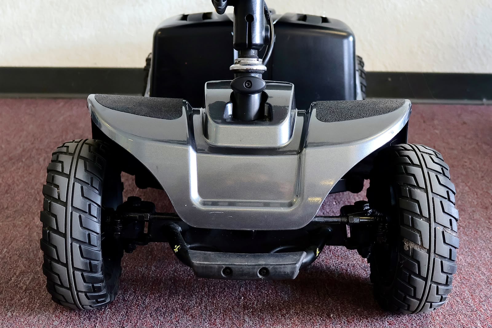 Pre-owned grey Pride Revo 2.0 4-wheel mobility scooter, photographed at the Mobility America showroom in Lakeland