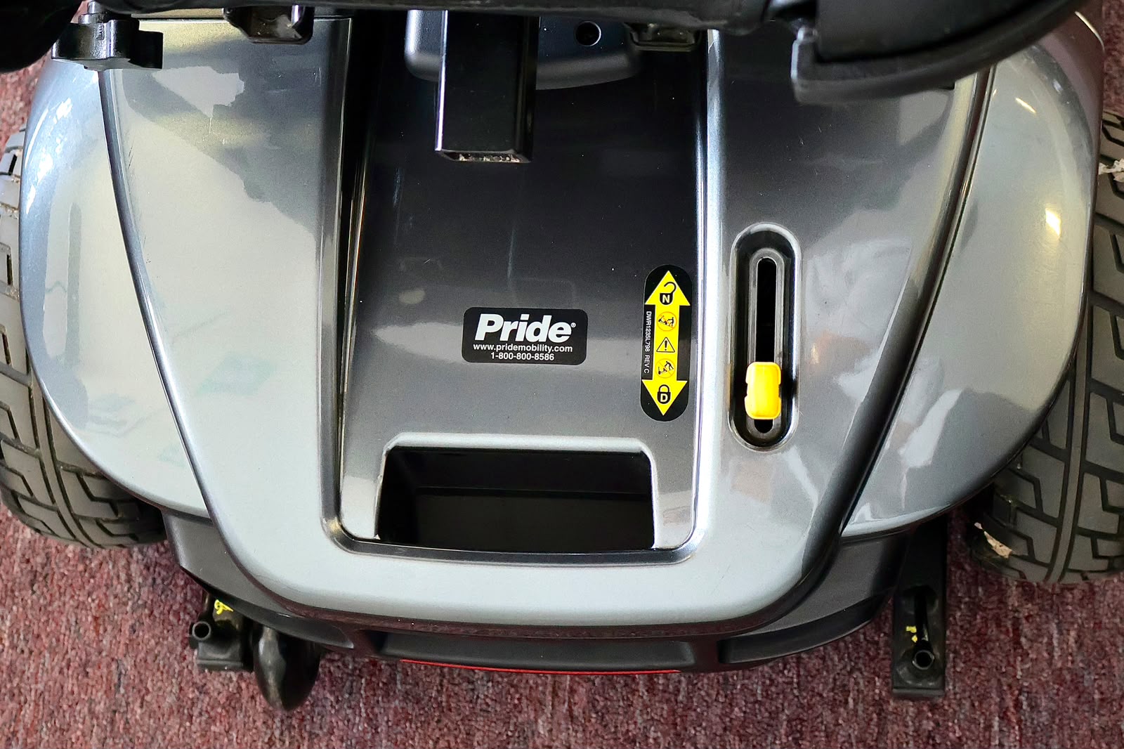 Pre-owned grey Pride Revo 2.0 4-wheel mobility scooter, photographed at the Mobility America showroom in Lakeland