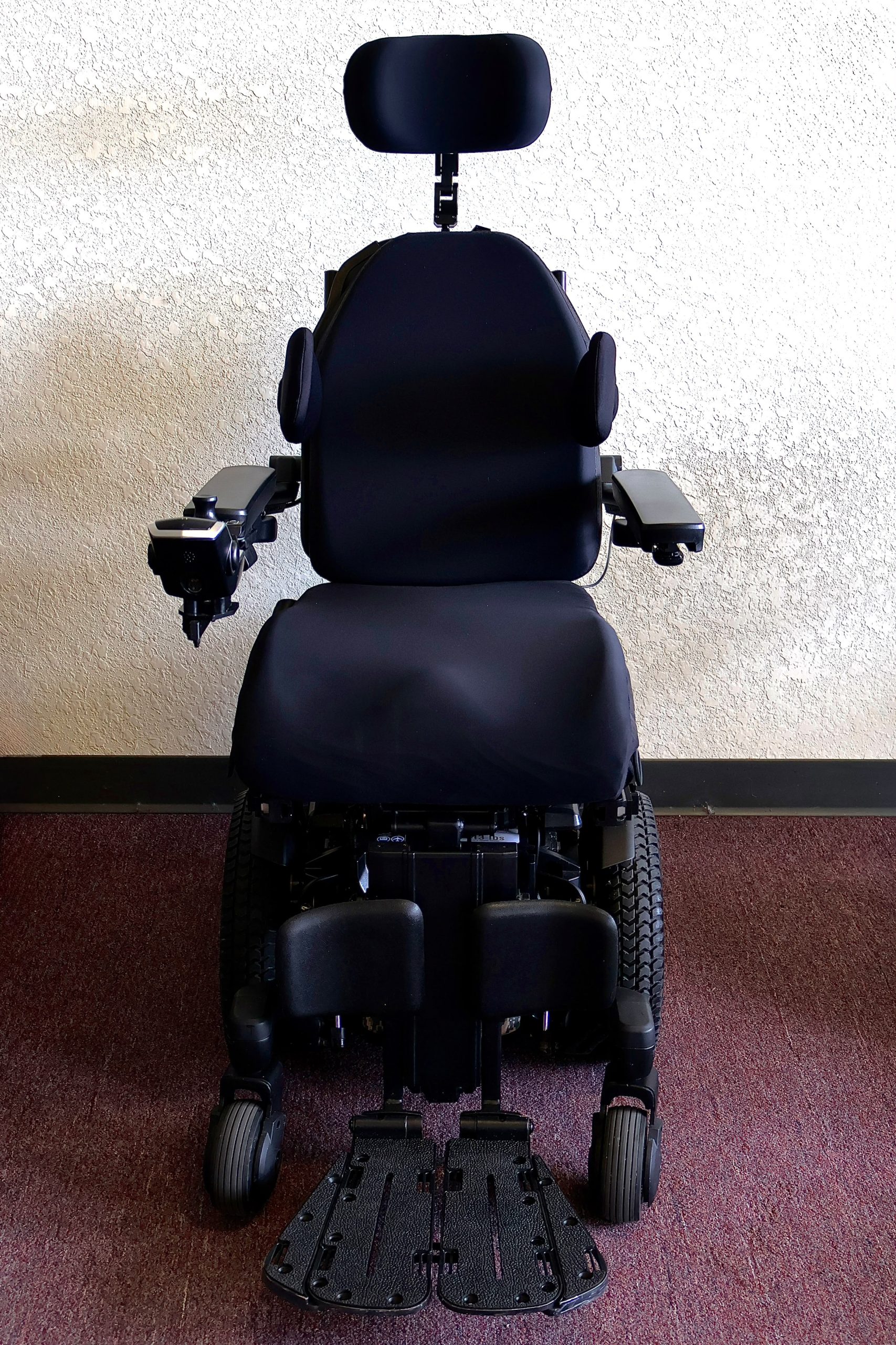 Pre-owned Quantum iLevel rehab power wheelchair in digital camo, photographed at the Mobility America showroom in Lakeland