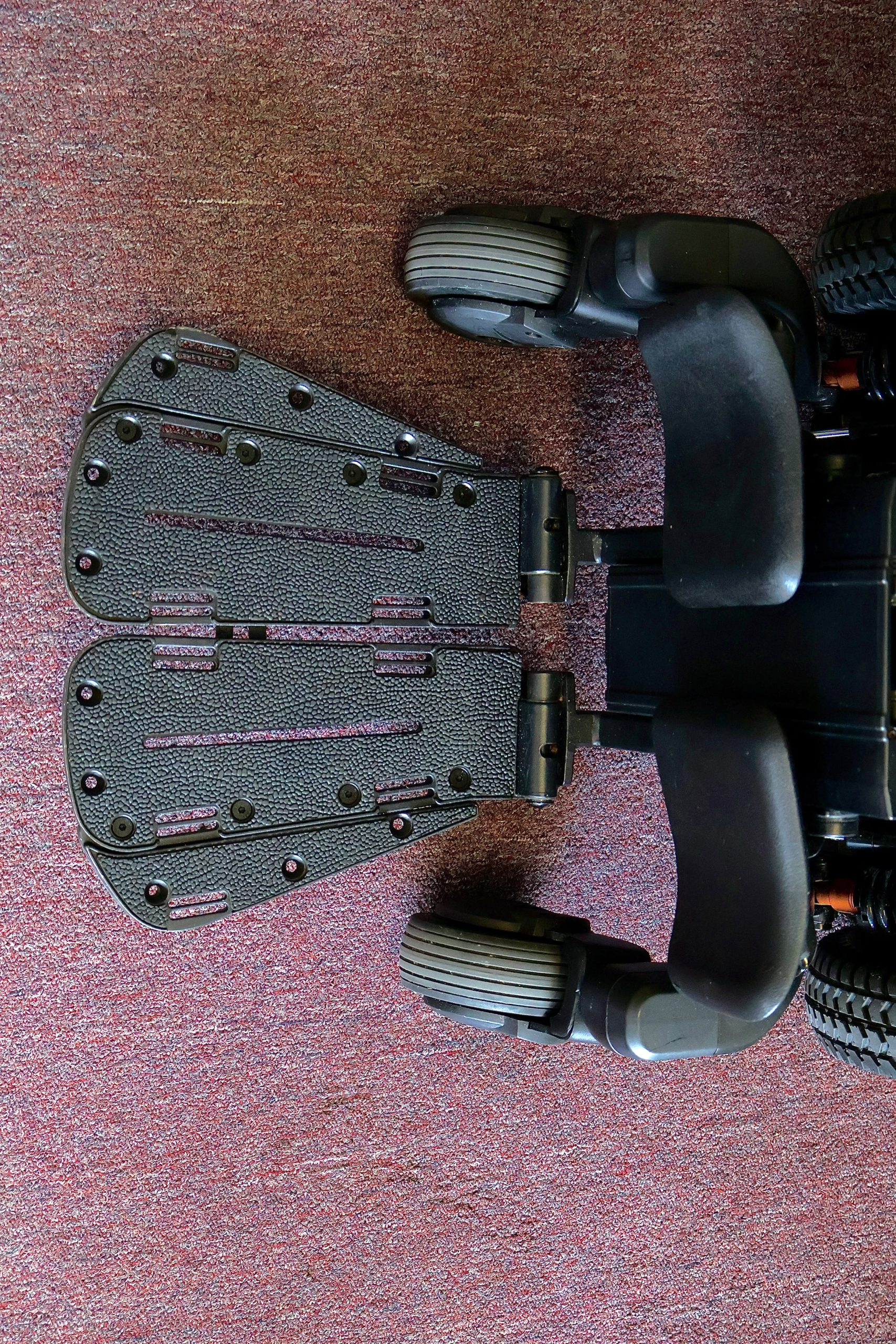 Pre-owned Quantum iLevel rehab power wheelchair in digital camo, photographed at the Mobility America showroom in Lakeland