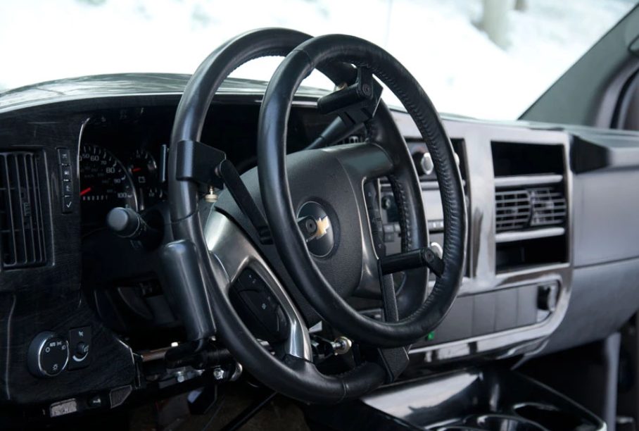 A steering wheel extension bringing the wheel closer to the driver in a van