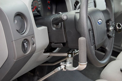 A turn signal crossover making the indicator lever reachable from the opposite side of the column